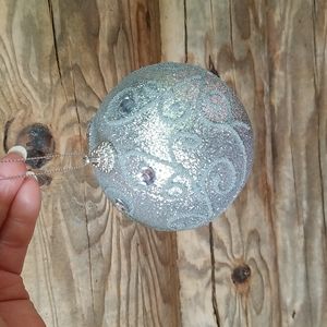 Sparkly, glittering, silver, large Christmas tree ball.